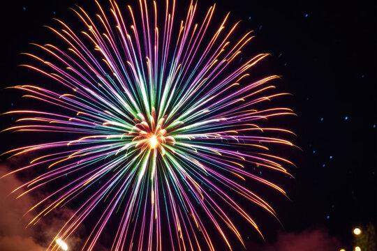 Colorful fireworks exploding in the dark night sky - Powered by Adobe