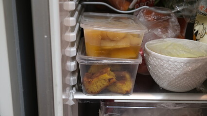 Food in plastic container is stored in the refrigerator to consume on next day.