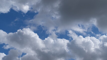 The appearance of clouds in a clear sky with a few overcast clouds