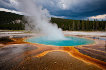 A serene scene featuring a blue pool of water with steam rising from the surface, great for backgrounds or relaxation-themed projects