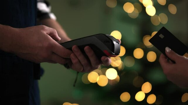 Waiter Processes Payment With Credit Card Terminal And Prints Receipt