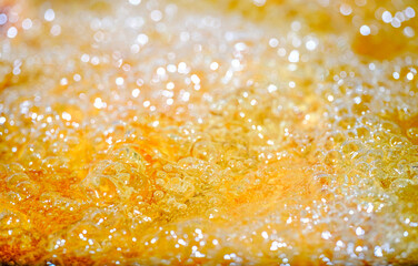 Close up bright orange Oil or beer splash texture and nature waves, Beautiful waves curve and...
