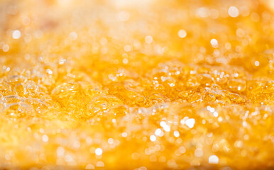 Close up bright orange Oil or beer splash texture and nature waves, Beautiful waves curve and...