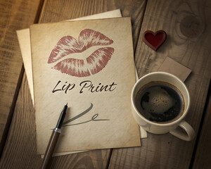 Cozy vintage composition with a lip print on kraft paper, a cup of aromatic coffee and a handwritten love letter