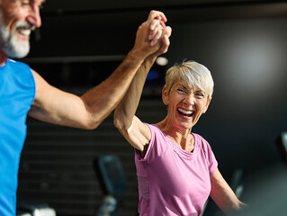 gym sport fitness exercising training mature running cardio treadmill healthy active teamwork success high five hand adult  athletic couple run coach fit endurance