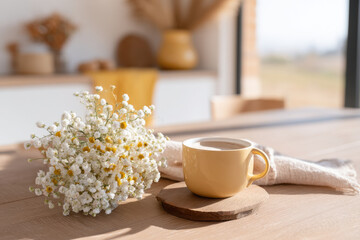 cozy breakfast nook in tiny house featuring rustic wooden table adorned with fresh flowers sunlight streaming