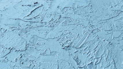 Textured Blue Surface: A close-up shot of a textured, pale blue surface, revealing intricate patterns and tactile details, suitable for backgrounds or abstract visual projects.