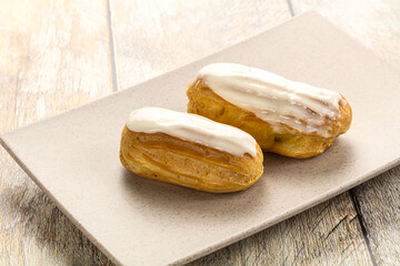 Delicous eclair with ising and cream