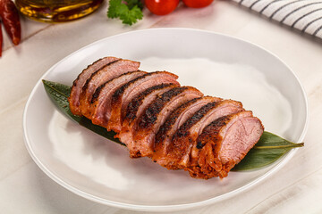 Sliced duck breast baked with cherry