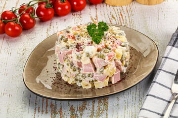 Russian traditional Olivier salad with sausages