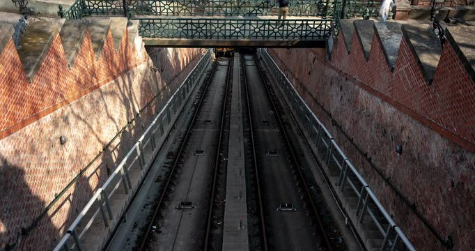 Budapest, Hungary - March 8, 2025: Budapest Funicular in Action – View from the Bridge. Timelapse, slide transition