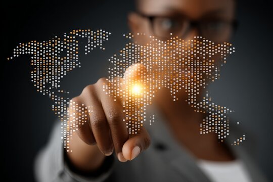 Person interacts with a digital world map using a touchscreen interface to highlight global connections and data visualization