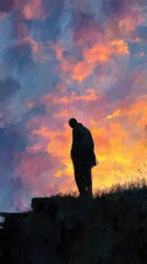 Silhouetted figure at sunset against a vibrant sky.