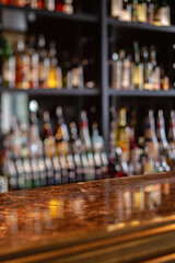 Bar counter with blurred image of bottles. Shallow depth of field.