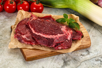 Raw beef cheeks cut for cooking