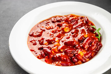 Chile con carne plate beans, tomato, corn, meat fresh delicious gourmet food background on the table rustic food top view copy space
