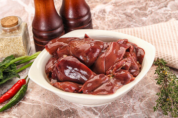 Raw uncokked chicken liver in the bowl
