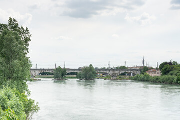 Obraz premium The railway bridge in Verona, on the Milan-Venice line, is a vital infrastructure enabling fast, efficient travel through northern Italy's key economic corridor.