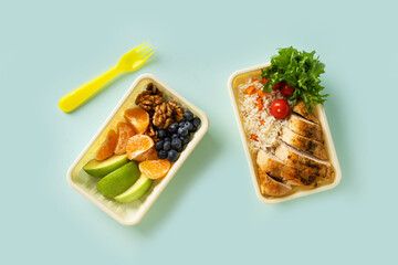 Lunch box with chicken, rice, vegetables, tomatoes, salad,