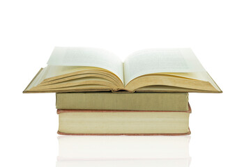 Old books are stacked and open isolated on white background with clipping path.