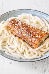 Udon Noodles With Baked Eel And Sweet Unagi Sauce In Bowl