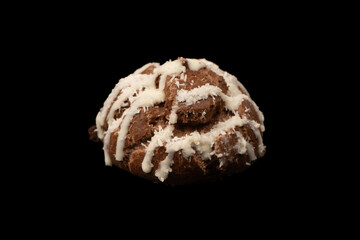 Profiteroles with coconut cream on a black background.