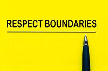 Respect boundaries text on yellow lines with pen representing awareness of personal space and...