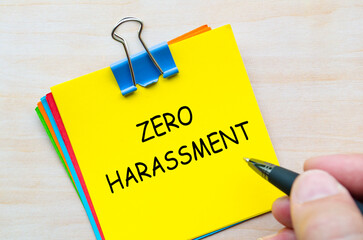 Zero harassment text on yellow sticky notes representing a no-tolerance policy towards abuse and misconduct