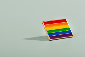 LGBT Badge accessory on a colored background
