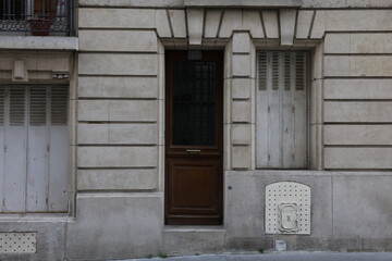 Naklejka premium Rustic Stone Building with Wooden Door and Number 