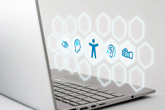 BFSG - Laptop with digital accessibility icons representing visual, auditory, cognitive, and motor impairments. Symbolic image for accessibility, inclusion.