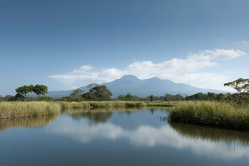 Fototapeta premium breathtaking view of mount samyan reflecting on still surface of serene lake surrounded by lush greenery and