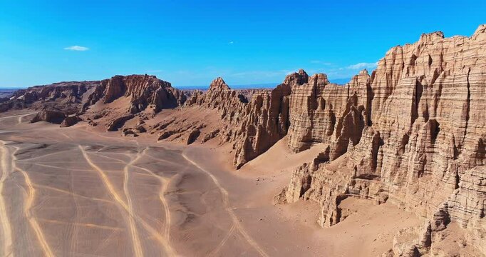 Aerial shot of spectacular yardang landform mountain in desert. Famous Dahaidao no man's land natural scenery in Xinjiang, China.