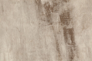 Natural wood texture featuring subtle grains and shades of brown from a surface in a well-lit indoor space