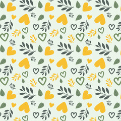 Obraz premium Seamless heart and leaf pattern in yellow and green cheerful botanical background. Summer autumn background. Floral textiles
