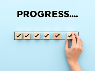 Progress tracking concept using wooden blocks with check marks for project management tasks complete