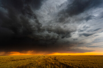 Awesome stormy scene as dark clouds threaten severe weather, filling the sky with dramatic texture, shadow, and moody atmosphere, capturing the raw power and beauty of nature in motion.