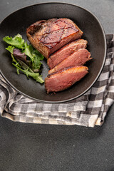 Duck breast roast meat poultry fresh delicious gourmet food background on the table rustic food top view copy space