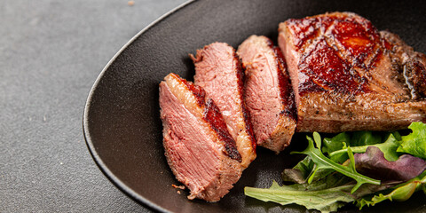 Duck breast roast meat poultry fresh delicious gourmet food background on the table rustic food top view copy space