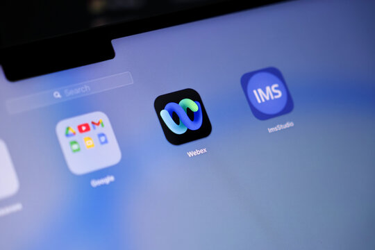 Poznan, Poland - May 15, 2025: Webex icon with abstract blue-green loop symbol centered on screen for launching video conferencing and remote communication in business and educational environments