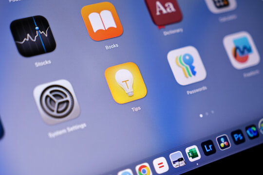 Poznan, Poland - May 15, 2025: Tips application icon with a yellow lightbulb displayed on a vivid digital tablet screen, offering guidance for effective device usage and feature exploration