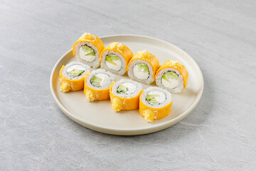 Mango Sushi Roll with Cream Cheese and Cucumber on Beige Plate
