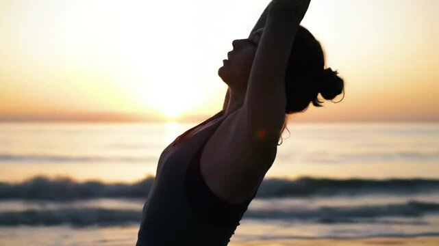 Backbend silhouette at sunrise seascape