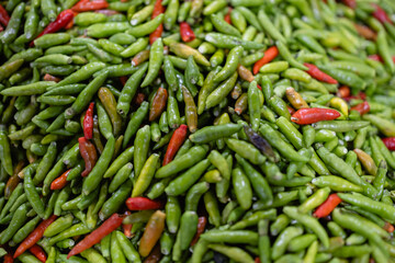 Traditional spice from Thailand market with fresh vegetables including green and red chili peppers for cooking flavor