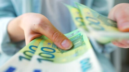 Woman counting euro bills, close-up - Powered by Adobe