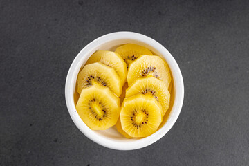 Kiwi yellow slices tasty fruit fresh delicious gourmet food background on table rustic food top view copy space keto and paleo diet vegan and vegetarian food