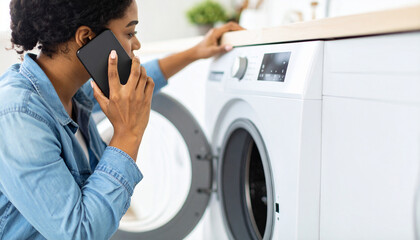 Worried woman calling technician about non-working washing machine, close-up hands view

