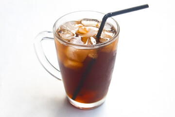 a glass of iced coffee with a straw isolated on a white background