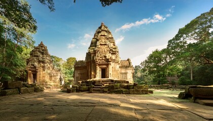 Naklejka premium sandstone temple complex with ancient architectural details surrounded by lush vegetation soft natural light