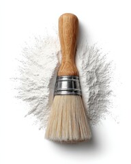 Wooden-handled brush in white powder.  Clean and simple image.